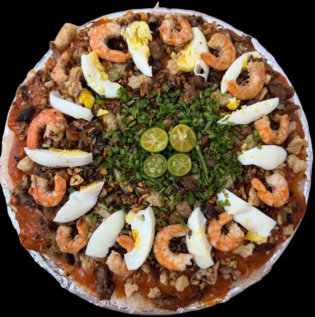 Fiesta Platter pancit palabok bilao topped with shrimp, egg and chicharrón